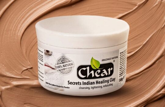 Jar of Chear Indian Healing Bentonite Clay Mask powder for oily skin, on a premium swirled clay texture background